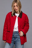 Person wearing a red jacket with brown trim on a gray background