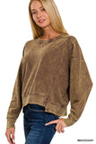 Woman wearing a brown mahogany sweatshirt on a white background