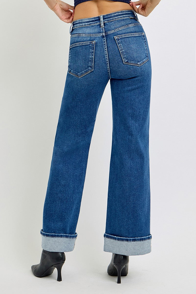 Blue jeans worn by a person on a white background