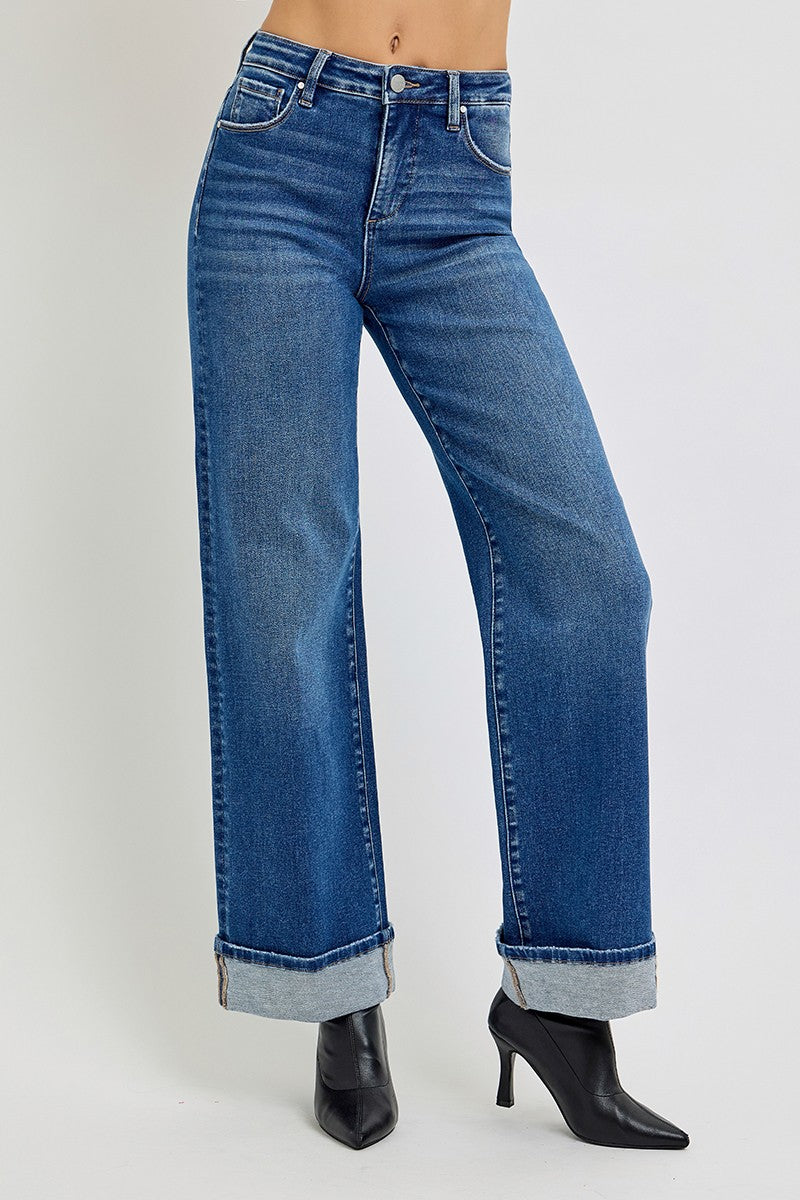 Blue jeans worn by a person on a white background