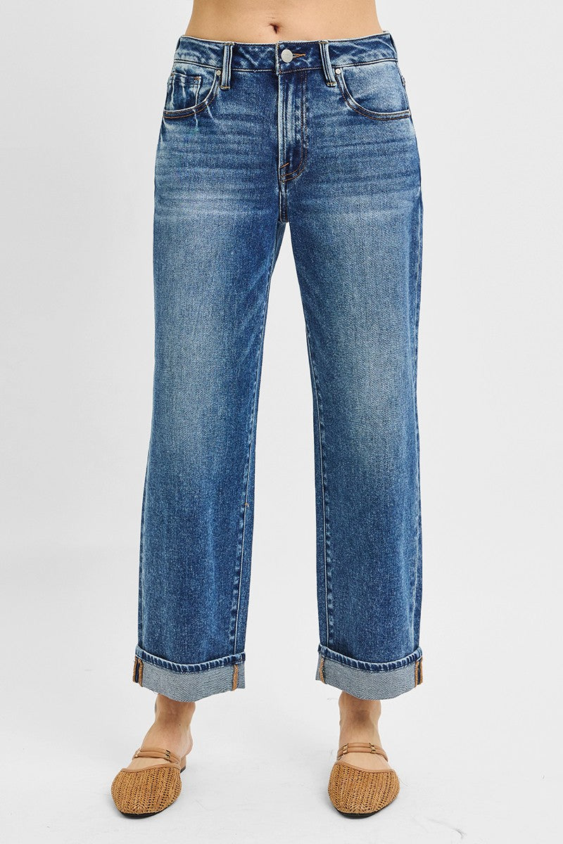 Blue jeans worn by a person on a white background