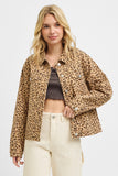 Woman wearing a leopard print jacket on a white background