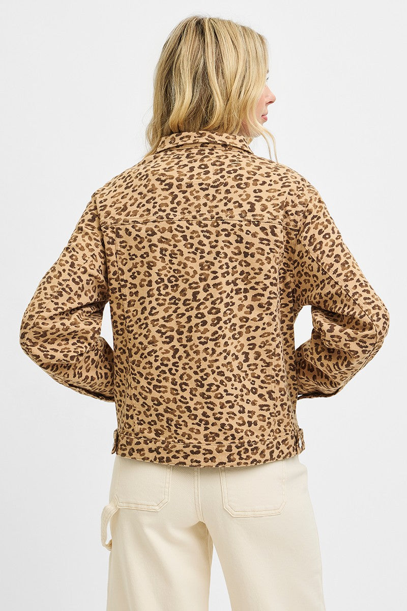 Person wearing a leopard print jacket on a white background