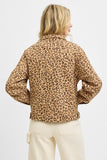 Person wearing a leopard print jacket on a white background
