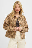 Woman wearing a leopard print jacket on a white background