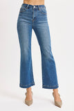 Blue jeans worn by a person on a white background