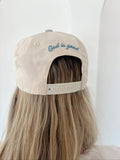 Back of Make Heaven Crowded Trucker Hat and it says God is good. 