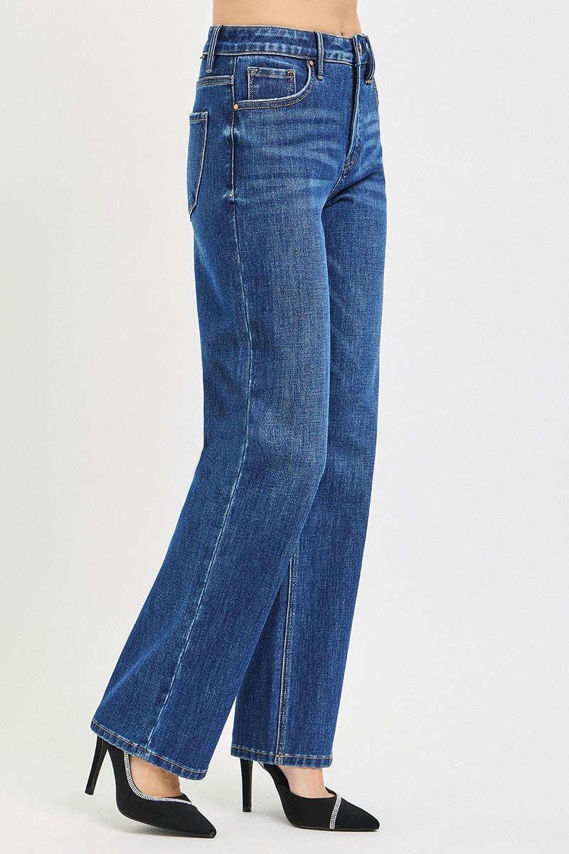 Blue jeans worn by a person on a white background