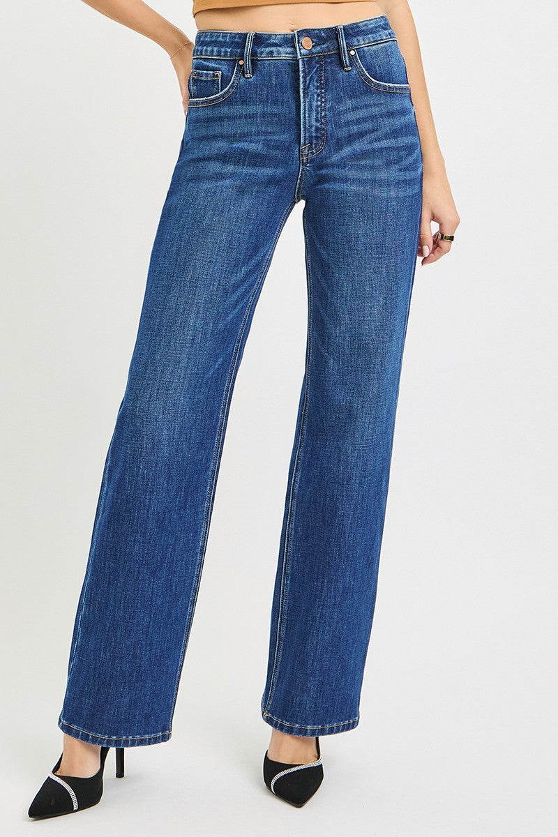Blue jeans worn by a person on a white background