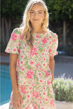 Woman wearing a floral dress by a poolside