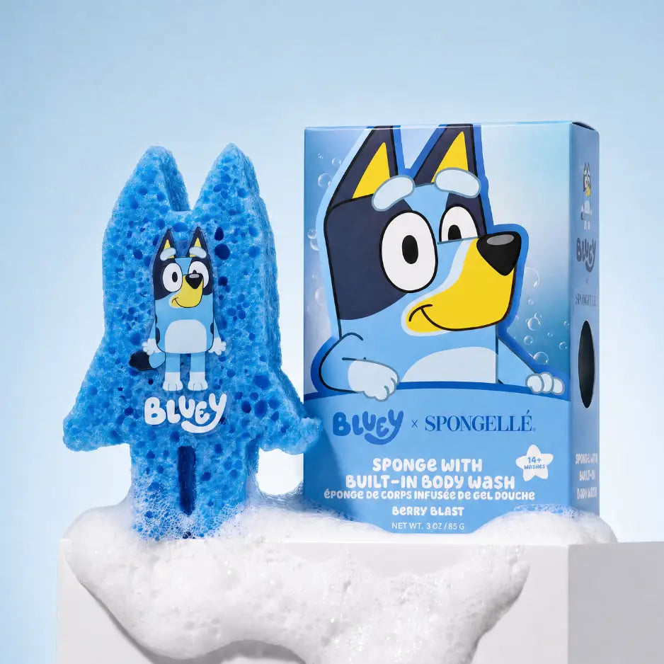 Bluey-themed sponge body wash product shown with a blue character-shaped sponge and its retail box on a white pedestal against a light blue background.