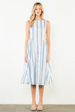 Woman wearing a blue and white striped dress against a white background