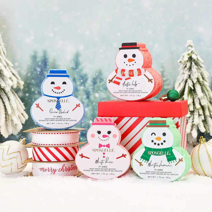 SpongeLefe bath bombs with Christmas-themed designs and snowman figures on a snowy background.