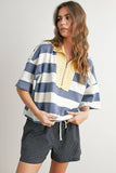 Woman wearing a striped shirt and checkered shorts on a plain background