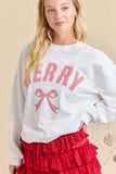 Woman wearing a white sweatshirt with red text and a red skirt on a beige background