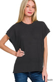 Woman wearing a black short-sleeve knit top on a white background
