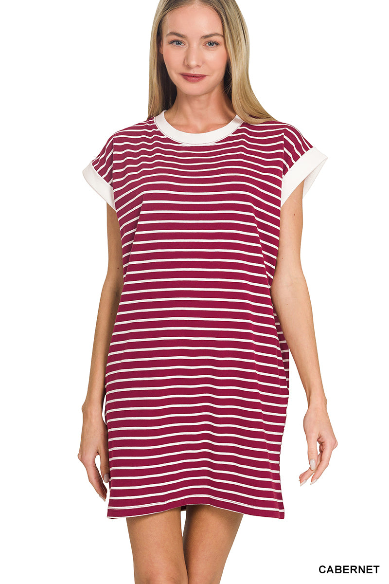 Woman wearing a red and white striped dress on a white background