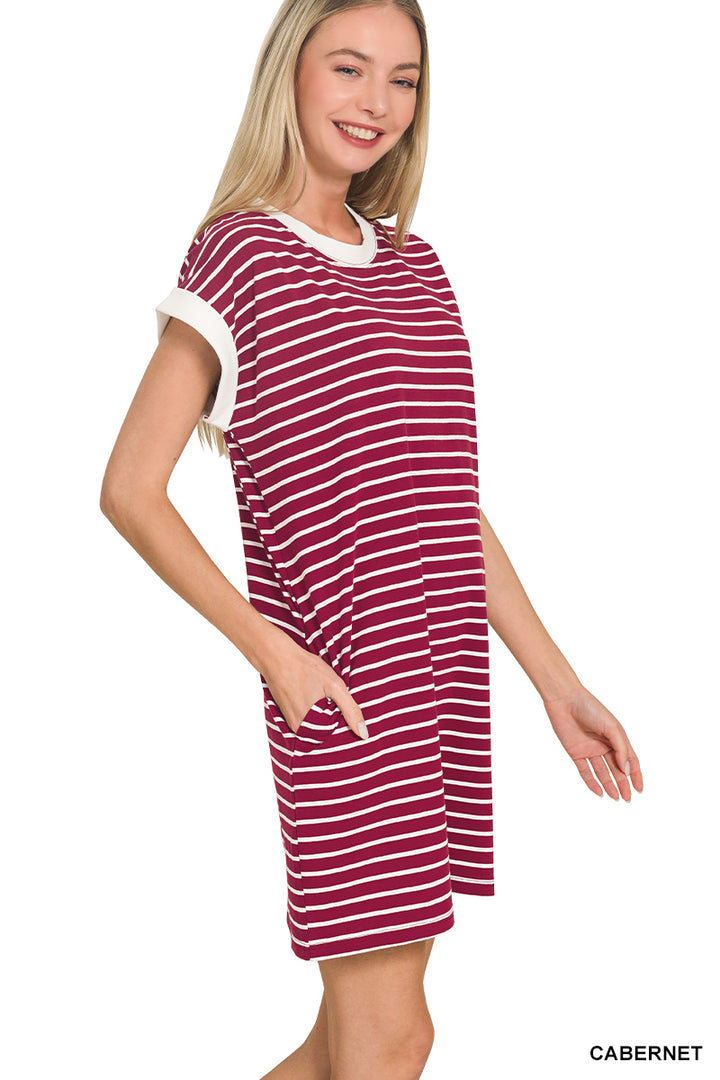 Woman wearing a red and white striped dress on a white background