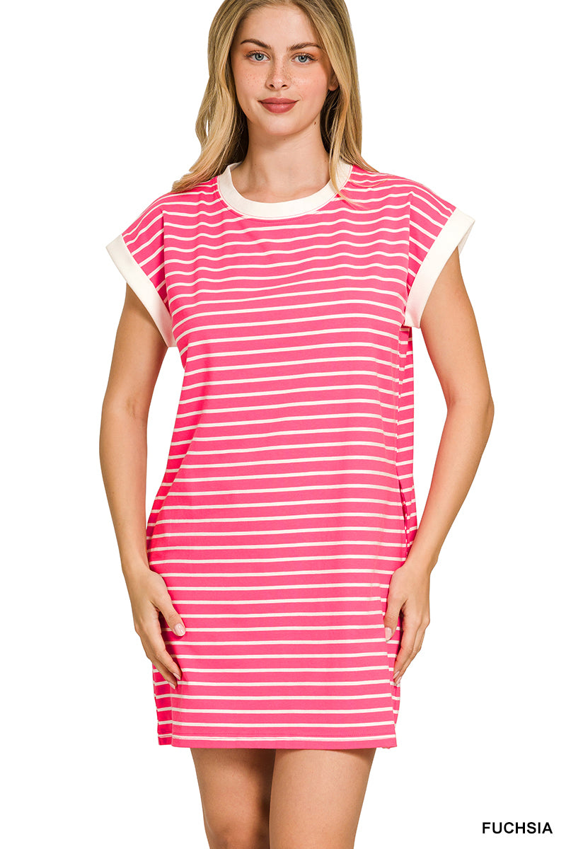 Woman wearing a pink and white striped dress on a white background
