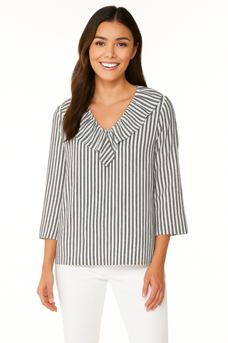 Woman wearing a black and white striped blouse on a white background