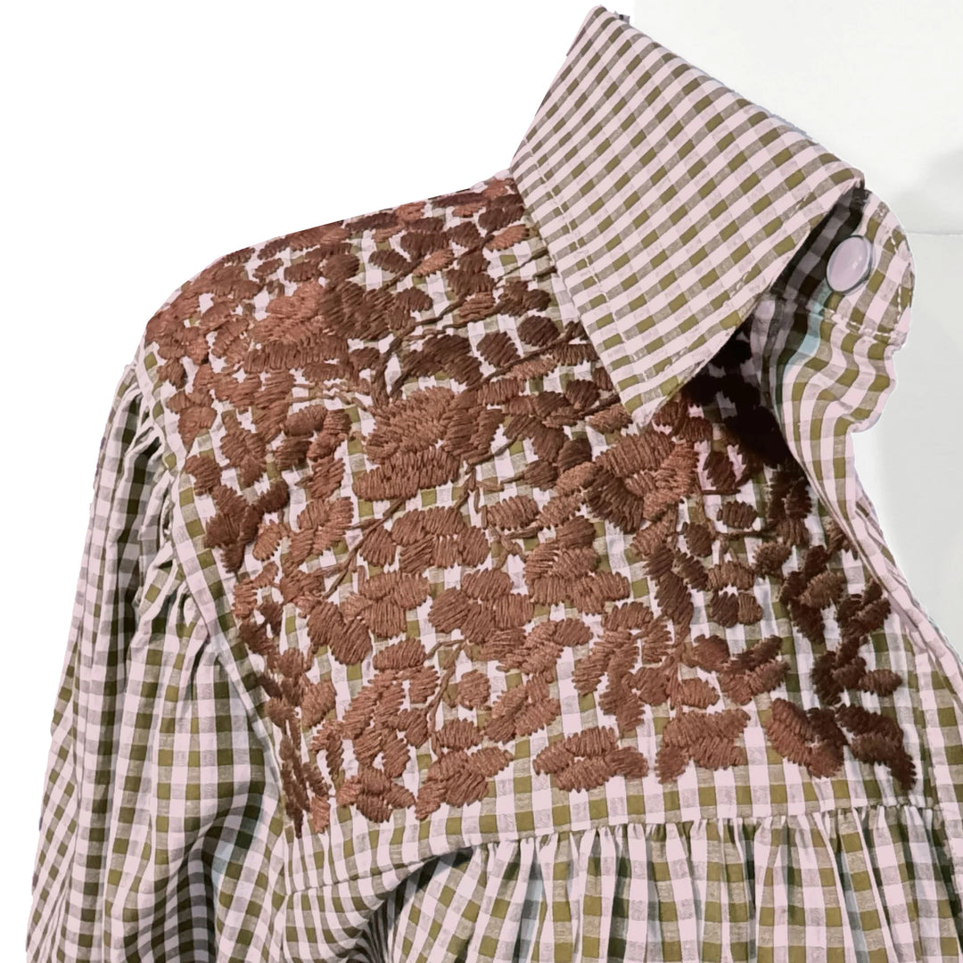 Floral-patterned dress with a checkered collar on a white background