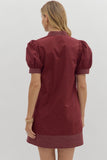 Maroon dress with puff sleeves on a white background