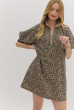 Woman wearing a leopard print dress on a white background