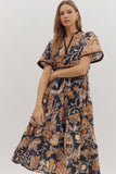 Woman wearing a floral dress with a neutral background