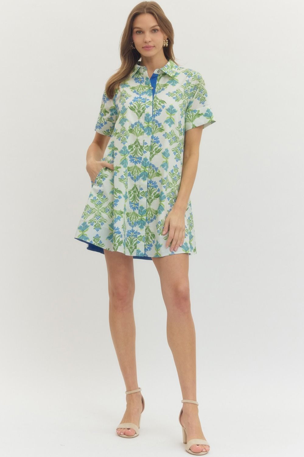 Woman wearing a floral dress on a white background