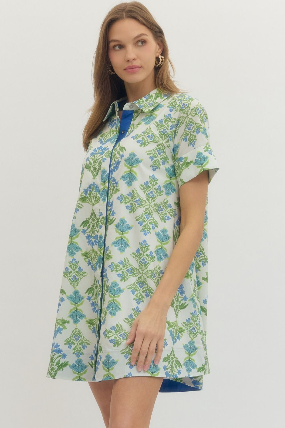 Woman wearing a floral dress with a white background