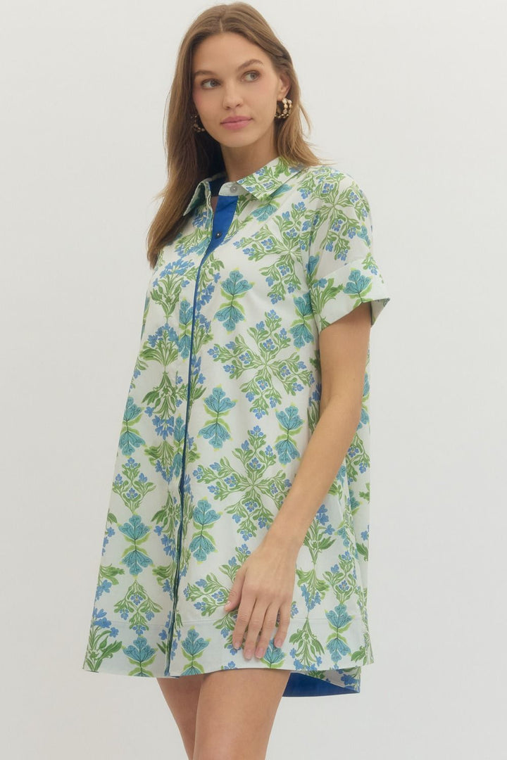Woman wearing a floral dress with a white background