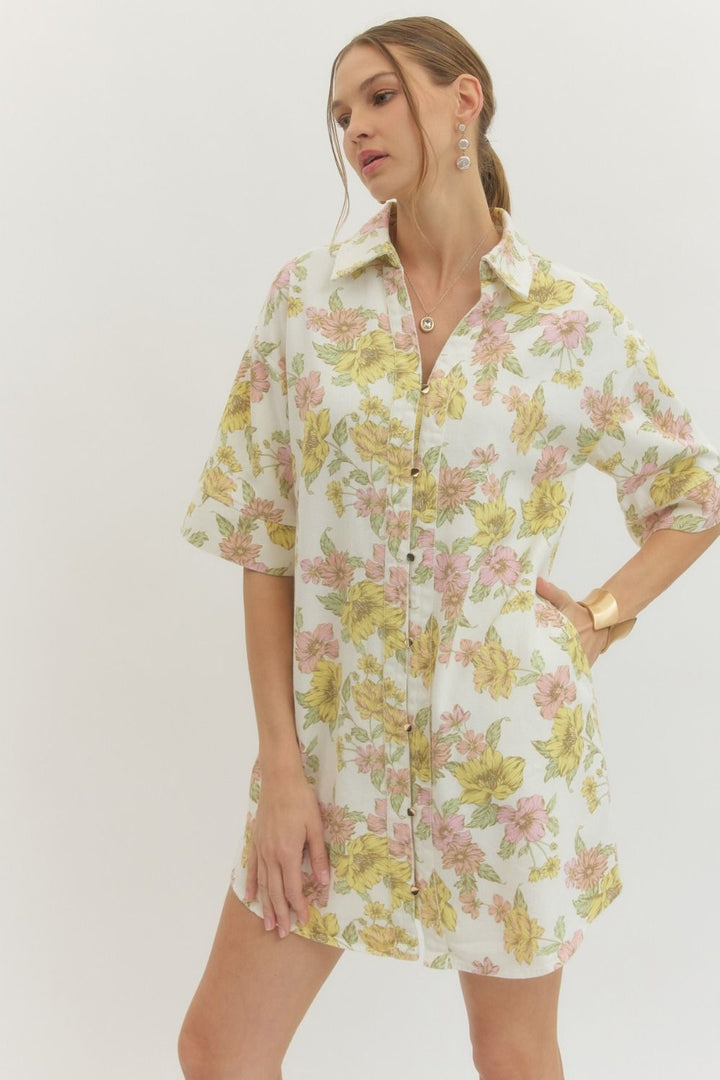 Woman wearing a floral dress on a white background