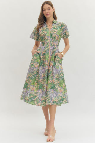 Woman wearing a floral dress on a white background