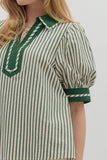 Green and white striped shirt with a collar on a plain background