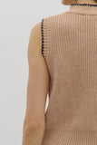 Beige sleeveless knitted top on a plain background