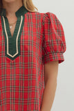 Red plaid dress with green accents on a plain background