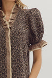 Leopard print dress with ruffled details on a plain background