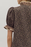 Leopard print dress with ruffled sleeves on a plain background
